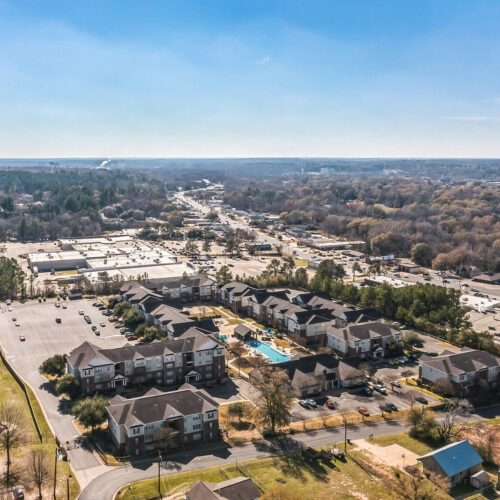 Wide aerial view of The Overlook student apartments and Nacogdoches TX city surroundings