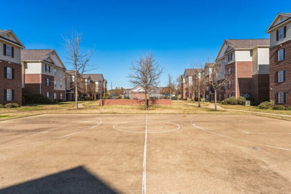 Full-size basketball court and open courtyard at The Overlook student apartments in Nacogdoches TX