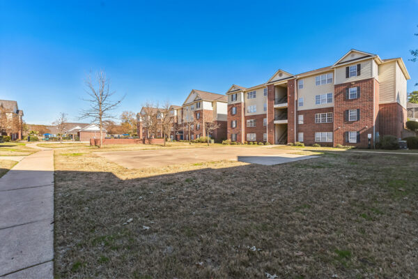 Exterior view of brick apartment buildings and landscaped grounds at The Overlook Nacogdoches TX