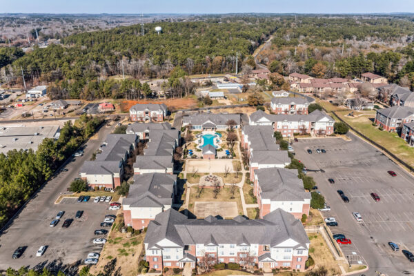 Aerial overhead view of The Overlook apartment community showing pool basketball court and volleyball area