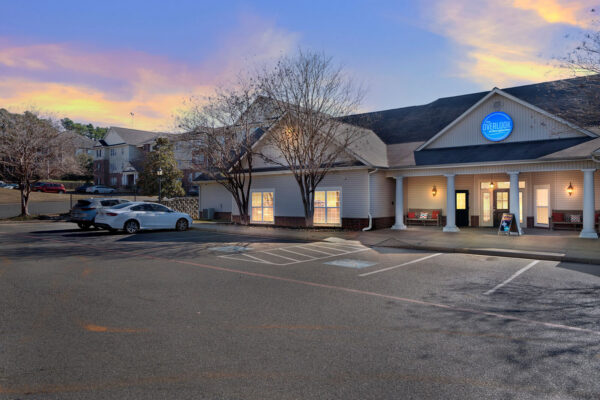 The Overlook at Nacogdoches leasing office exterior at dusk near SFA campus
