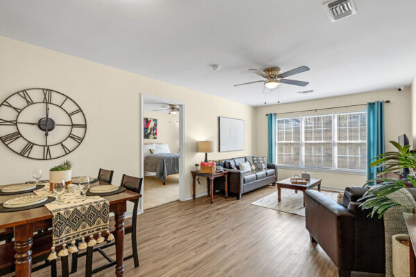Open-plan furnished living and dining room in a student apartment at The Overlook Nacogdoches TX