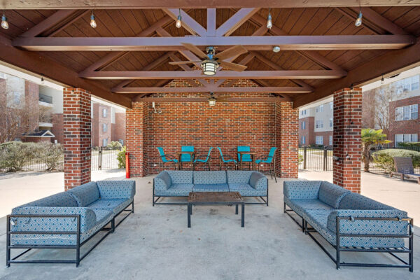 Covered outdoor lounge and seating area at The Overlook student apartments near SFA Nacogdoches