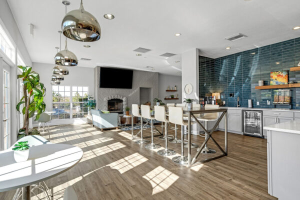 Clubhouse kitchen bar and lounge area with fireplace at The Overlook student apartments Nacogdoches